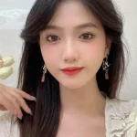 Hollow-out Crane Baofu Stud Earrings-1